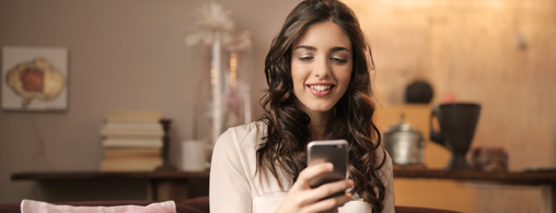 Happy Woman Using Smartphone
